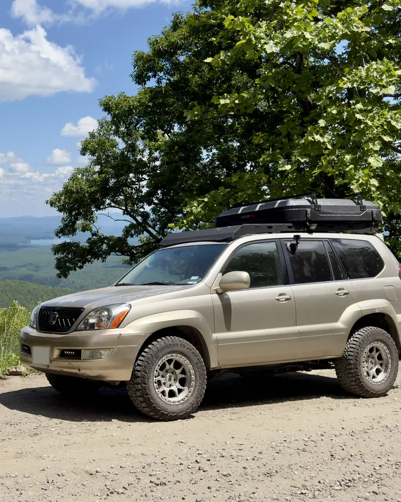 Ginny on a gravel overlook above a lake